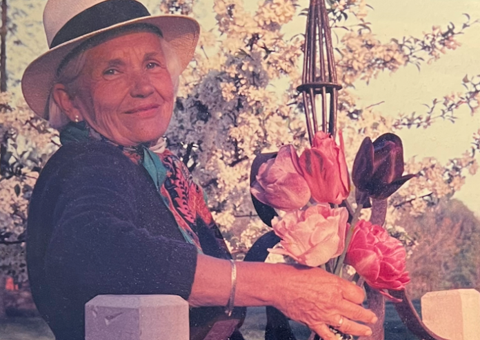 Woman holding a basket of flowers